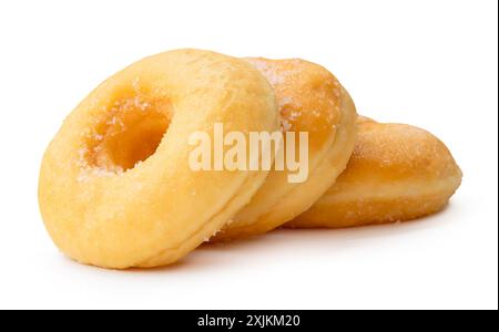 Side view of glazed sugar brown cinnamon donuts in stack is isolated on white background with clipping path. Stock Photo