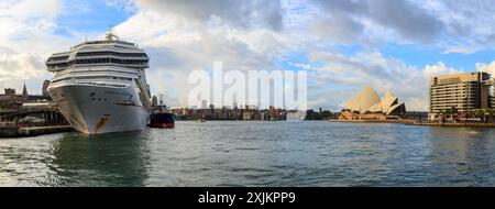 A panoramic view of Sydney Harbour, Sydney, Australia, with the iconic Opera House  and the cruise ship Carnival Splendor Stock Photo