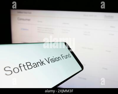 Stuttgart, Germany, 09-08-2022: Smartphone with logo of venture capital fund SoftBank Vision Fund on screen in front of business website. Focus on Stock Photo