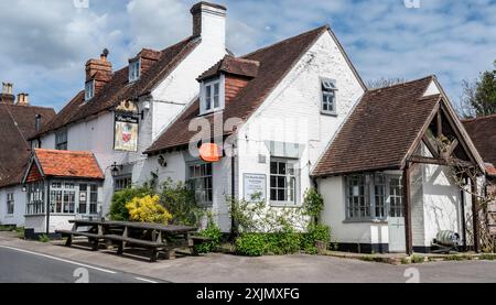 Post office sign on pub wall indicating postal service in a rural public house for use by villagers in Droxford, Hampshire. Stock Photo