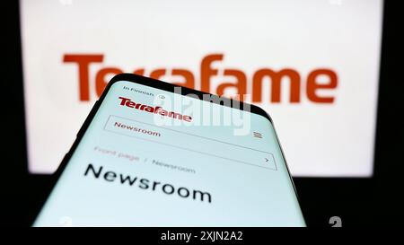 Stuttgart, Germany, 03-08-2023: Mobile phone with webpage of Finnish battery chemicals company Terrafame Oy on screen in front of logo. Focus on Stock Photo