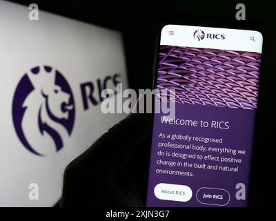 Stuttgart, Germany, 03-18-2023: Person holding cellphone with logo of ...