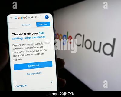 Stuttgart, Germany, 06-18-2023: Person holding cellphone with webpage of computing services Google Cloud Platform (GCP) on screen with logo. Focus on Stock Photo