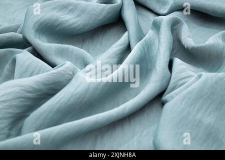 Soft, flowing blue fabric texture close-up Stock Photo