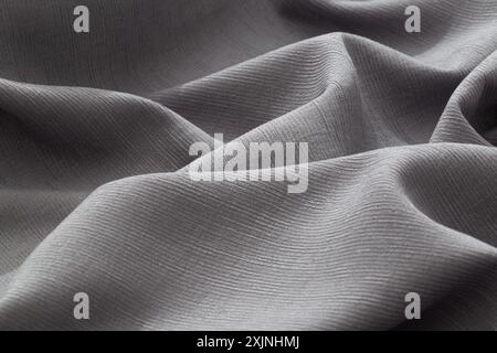 Soft, smooth gray fabric texture close-up. Stock Photo