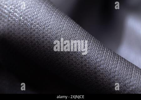 Close-up of a textured dark gray fabric. Stock Photo
