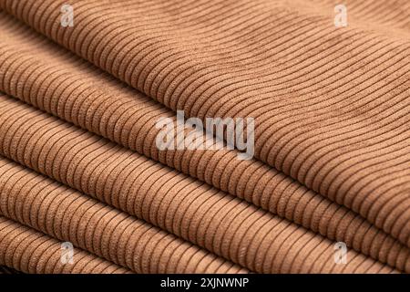 Close-up of folded brown ribbed fabric. Stock Photo