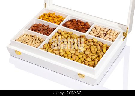 Assorted nuts in a white wooden box. Stock Photo