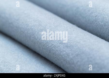 Light blue fabric rolls, close-up view Stock Photo