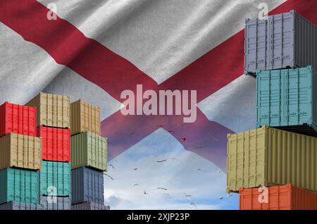 Alabama US state flag and big stack of shipping cargo containers in ...