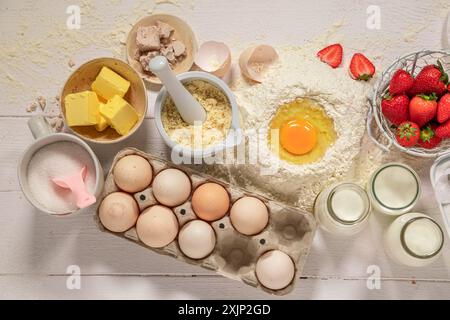 Sweet strawberry yeast cake freshly baked at home. Yeast cake with strawberries and ingredients. Stock Photo