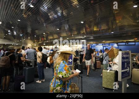 Milwaukee, USA. 19th July, 2024. Passengers wait at Milwaukee Mitchell International Airport in Milwaukee, Wisconsin, the United States, on July 19, 2024. Multiple U.S. airlines said their flights would be delayed or canceled on Friday due to technical issues involving cybersecurity giant CrowdStrike and Microsoft. Credit: Wu Xiaoling/Xinhua/Alamy Live News Stock Photo