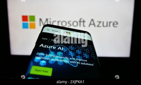 Stuttgart, Germany, 07-11-2023: Mobile phone with webpage of cloud computing platform Microsoft Azure on screen in front of business logo. Focus on Stock Photo