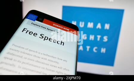 Stuttgart, Germany, 07-22-2023: Mobile phone with website of organization Human Rights Watch (HRW) on screen in front of logo. Focus on top-left of Stock Photo