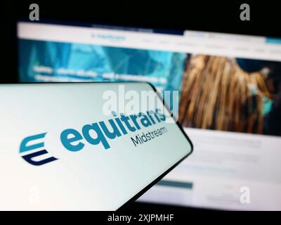 Stuttgart, Germany, 07-28-2023: Smartphone with logo of American company Equitrans Midstream Corporation on screen in front of website. Focus on Stock Photo