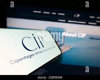 Stuttgart, Germany, 07-28-2023: Smartphone with logo of Copenhagen Infrastructure Partners PS (CIP) on screen in front of website. Focus on Stock Photo