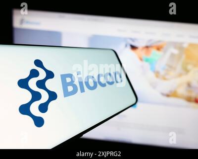 Stuttgart, Germany, 08-26-2023: Cellphone with logo of Indian biopharmaceutical company Biocon Limited on screen in front of website. Focus on Stock Photo