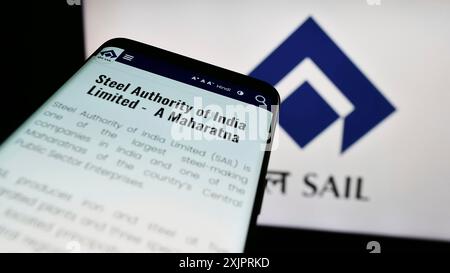 Stuttgart, Germany, 08-26-2023: Smartphone with website of company Steel Authority of India Limited (SAIL) on screen in front of logo. Focus on Stock Photo