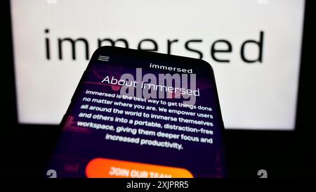 Stuttgart, Germany, 08-30-2023: Smartphone with website of US virtual reality company Immersed Inc. on screen in front of business logo. Focus on Stock Photo