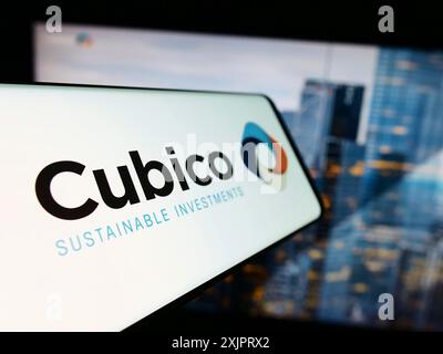 Stuttgart, Germany, 08-28-2023: Smartphone with logo of company Cubico Sustainable Investments Limited on screen in front of website. Focus on Stock Photo