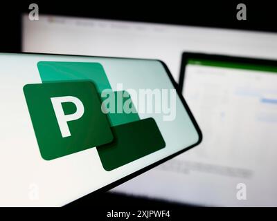Stuttgart, Germany, 09-21-2023: Smartphone with logo of project management software Microsoft Project on screen in front of website. Focus on Stock Photo