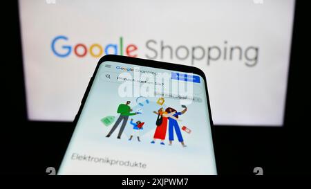 Stuttgart, Germany, 09-23-2023: Smartphone with webpage of product search platform Google Shopping on screen in front of business logo. Focus on Stock Photo