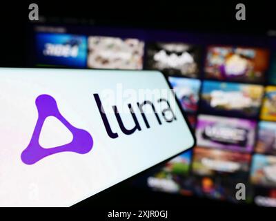 Stuttgart, Germany, 11-08-2023: Mobile phone with logo of American cloud gaming platform Amazon Luna in front of company website. Focus on left of Stock Photo