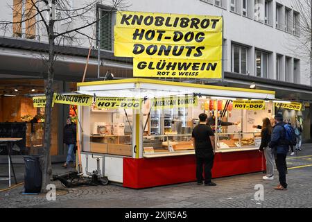 Take-away garlic bread, hot dog, donuts and mulled wine Stock Photo