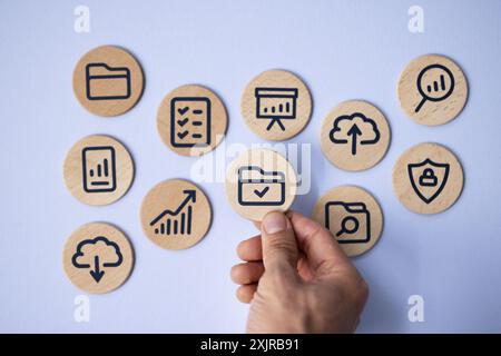 Man Holding Blue Wooden Sign: Business Technology and Digital Marketing Management in the Cyberspace Era of Corporate Finance Stock Photo