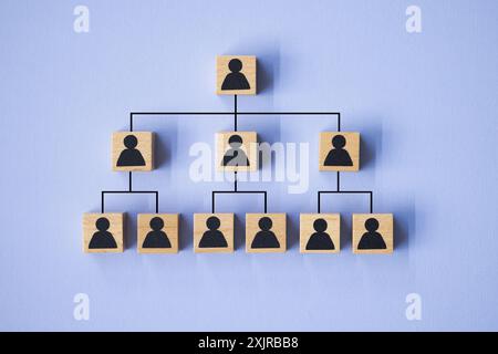 Corporate Teamwork and Communication: Pink and Blue Icons Representing Team Structure in Business Organization Stock Photo