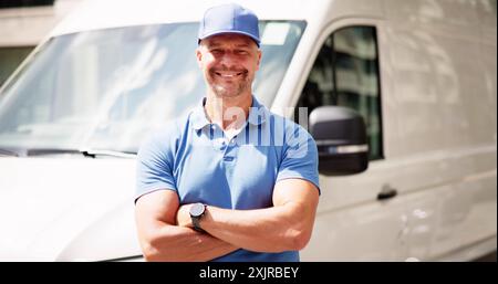 Professional Delivery Men Smiling in Uniform Near Service Truck on a Sunny Day, Providing Efficient Customer Service to Businesses. Stock Photo
