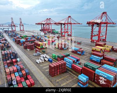 LIANYUNGANG, CHINA - JULY 20, 2024 - Cargo ships stop at their berths ...