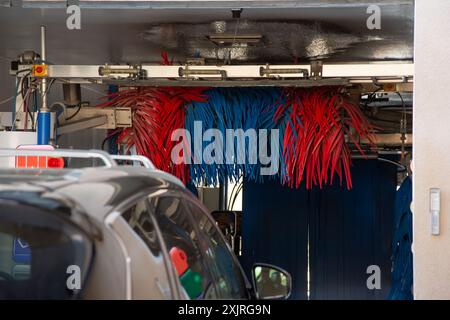 A view of a car entering a car wash facility. Stock Photo