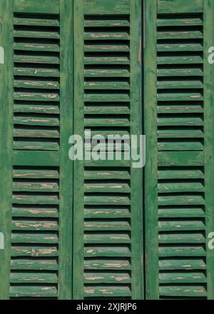 wooden, green, old shutters on the window Stock Photo