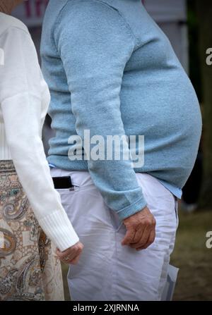 man with big  stomach indicating obeisity norfolk england Stock Photo