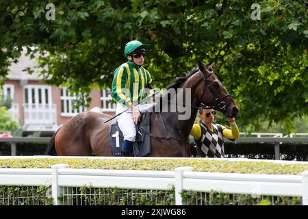 Ascot, Berkshire, UK. 12th July. 2024. Horse Magnum Opus ridden by jockey Callum Shepherd heads out onto the racetrack for the Long Harbour Derek Lucie-Smith Handicap Stakes at Ascot Racecourse in Berkshire at the Ascot Summer Mile Property Raceday. Owner Rabbah Racing, Trainer Simon & Ed Crisford, Newmarket, Breeder Godolphin. Credit: Maureen McLean/Alamy Stock Photo