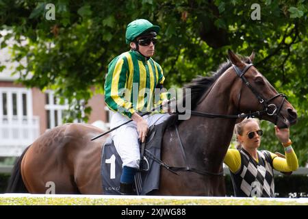 Ascot, Berkshire, UK. 12th July. 2024. Horse Magnum Opus ridden by jockey Callum Shepherd heads out onto the racetrack for the Long Harbour Derek Lucie-Smith Handicap Stakes at Ascot Racecourse in Berkshire at the Ascot Summer Mile Property Raceday. Owner Rabbah Racing, Trainer Simon & Ed Crisford, Newmarket, Breeder Godolphin. Credit: Maureen McLean/Alamy Stock Photo