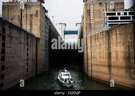 Three Gorges Dam spillways and navigation lock vessel traffic boat door ...