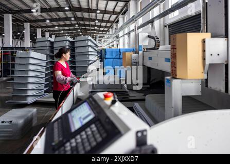 SUQIAN, CHINA - JULY 20, 2024 - A worker is working at a smart luggage production line in Suqian, East China's Jiangsu province, July 20, 2024. Stock Photo