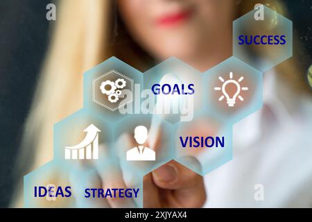 Person touching an hexagonal button on a digital interface Stock Photo