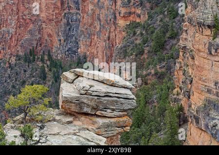 Weathered promontory juts out towards facing canyon wall of Grand Canyon Stock Photo