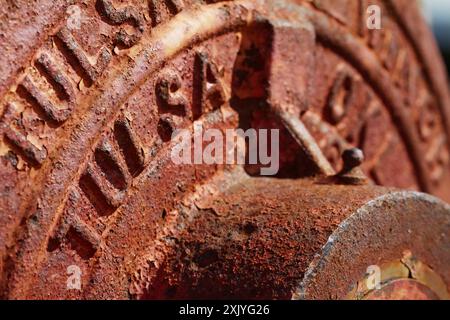 Close Up Detail Of The Trade Name Stamped Onto A 1960s Rusty Metal Tulsa Planetry Winch, UK Stock Photo