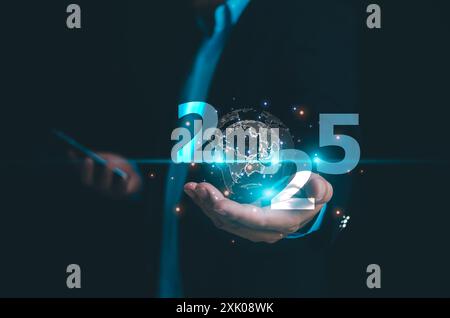 Hand holding the modern and digital globe with 2025 new year on modern background, Digital transformation trend in 2025, Technology trend, business tr Stock Photo