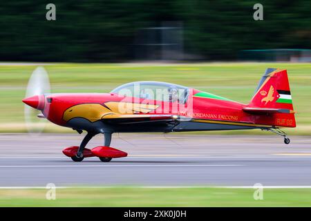 The Royal Jordanian Falcon Extra EA330SC is performing during the Royal International Air Tattoo at RAF Fairford in Gloucestershire, England, on Saturday, July 20, 2024. (Photo by MI News/NurPhoto) Credit: NurPhoto SRL/Alamy Live News Stock Photo