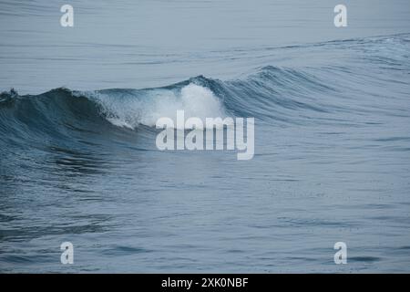 Rolling breaking waves Stock Photo