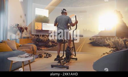 African American sportsman wearing AR headset trains on orbitrek. Virtual screen shows landscape and fitness application interface with timer and health care statistics. Metaverse futuristic home gym. Stock Photo