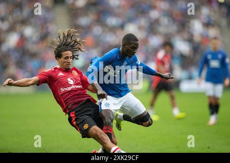 Edinburgh, Scotland, United Kingdom, 20th July 2024 - Mohamed Doimande tussles with Hannibal Mejbri during the pre-season friendly match at Scottish Gas Murrayfield Stadium, Edinburgh on 20/07/2024 between Manchester United and Rangers - Credit: Thomas Gorman/Alamy News Live Stock Photo