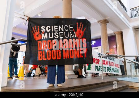 London, UK. 20 July 2024. Activists from Parents For Palestine protest inside the Science Museum. The activists demand the Science Museum to drop Adani’s sponsorship of the museum because of Adani’s sale of weapons and drones to Israeli businesses and the IDF ( Israel Defense Forces). Credit: Andrea Domeniconi/Alamy Live News Stock Photo