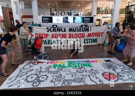 London, UK. 20 July, 2024. Activists from Parents For Palestine occupy the Science Museum in protest against museum sponsorship by Adani Green Energy, part of an Indian conglomerate whose weapons manufacturing division, Adani Defence & Aerospace, supplies weapons used by Israel on Gaza. Credit: Ron Fassbender/Alamy Live News Stock Photo