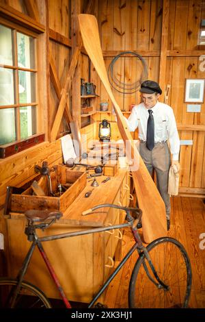 College Park Aviation Museum Aircraft Artifacts College Park Maryland | COLLEGE PARK, Maryland, United States — A period workshop diorama inside the College Park Aviation Museum recreates the tools, bicycle, and clothing of an early twentieth-century mechanic, evoking the improvisational craft behind the Wright brothers' era of flight. Wilbur Wright began instructing Army pilots at College Park Airport on October 6, 1909, just six years after the first powered flight at Kitty Hawk, when aircraft and bicycles shared overlapping mechanical technology and workshops. Stock Photo
